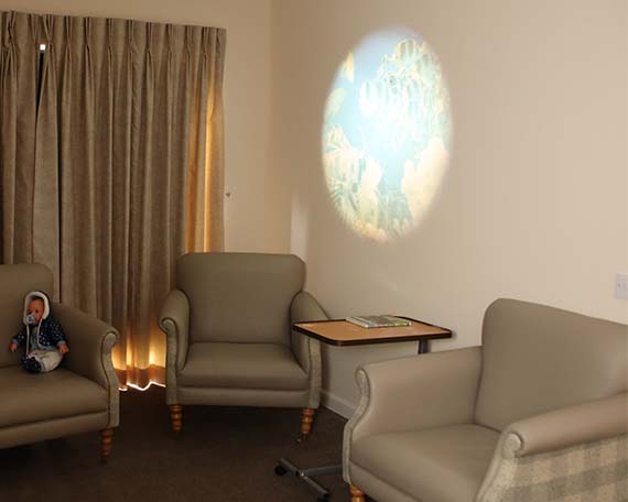 Armchairs and Projector on Wall in Dementia Unit
