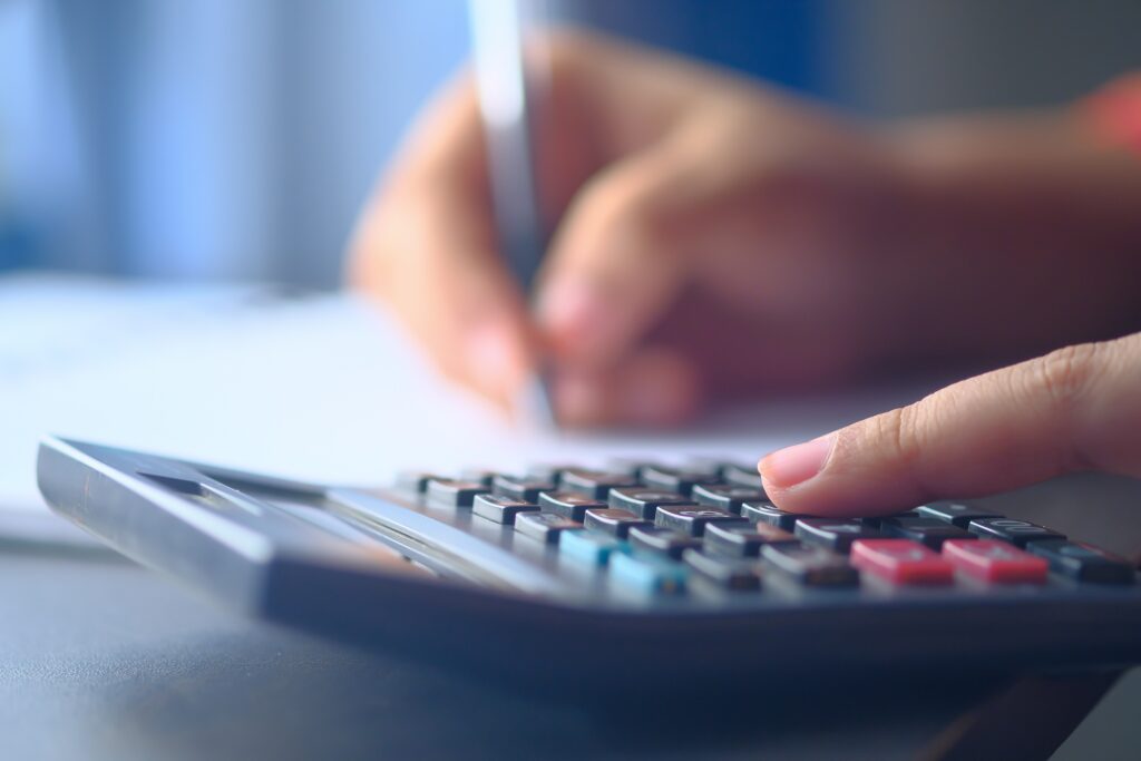 Calculator Being Used by Woman