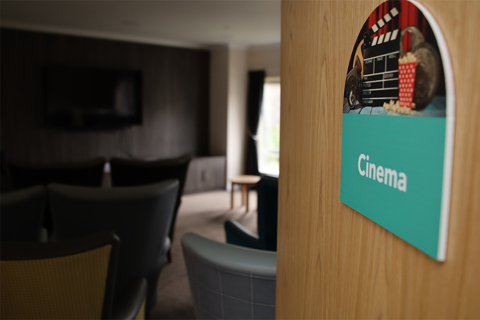 cinema room with door sign