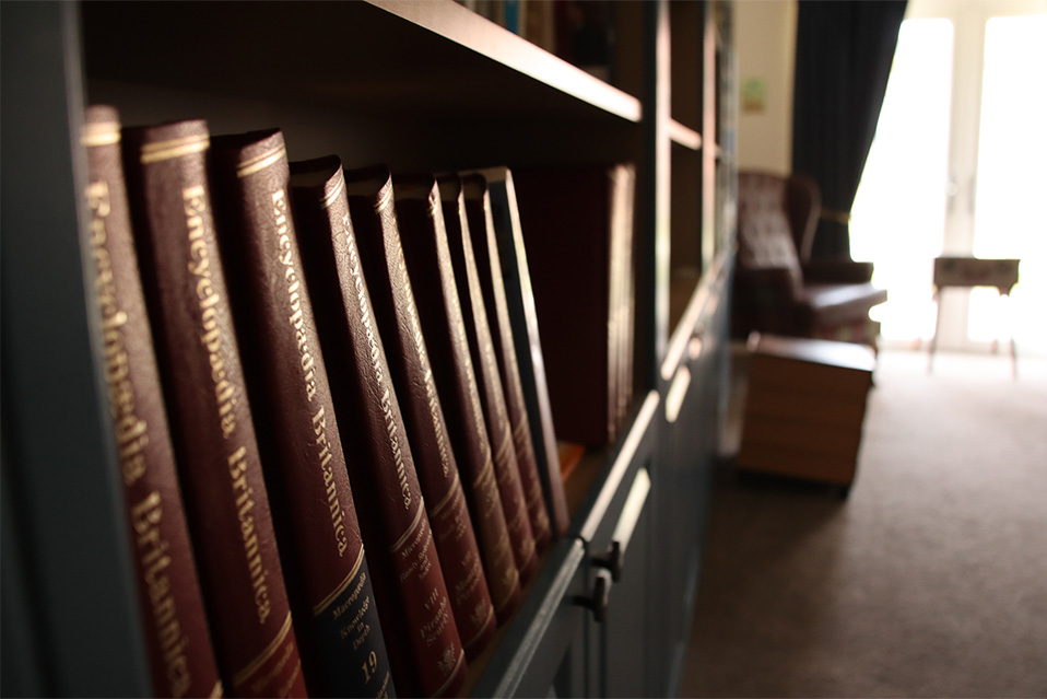 leather-bound books in springvale care home library