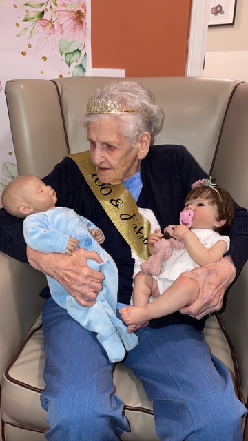 older lady with baby dolls