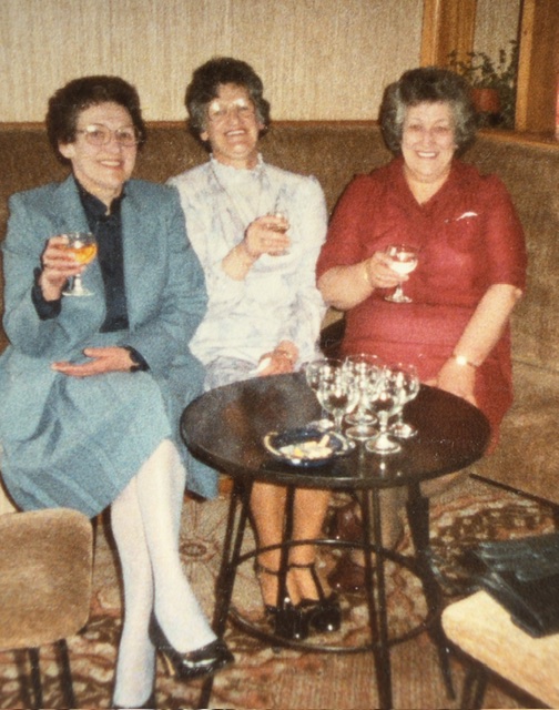 three older ladies sat down with drinks