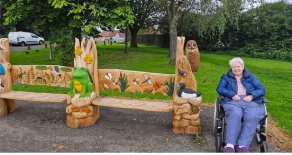resident by a wlidlife bench